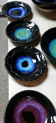The Potter’s Choice over Celadon Combination test tiles were created by BRUSHING on three coats of C-1 Obsidian as a base, then three coats of the Potter’s Choice color over that. Let dry between coats. Use a fan brush for a more even coverage. AMACO® 11-M, a Cone 5-6 stoneware clay was used to create the test tiles. Test tiles were fired to Cone 6 at medium speed with a 10 minute hold.
